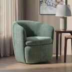 Swivel accent chair in green velvet with rounded arms and contoured seat cushion.