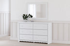 White dresser with mirror, six drawers with round knobs, scalloped apron