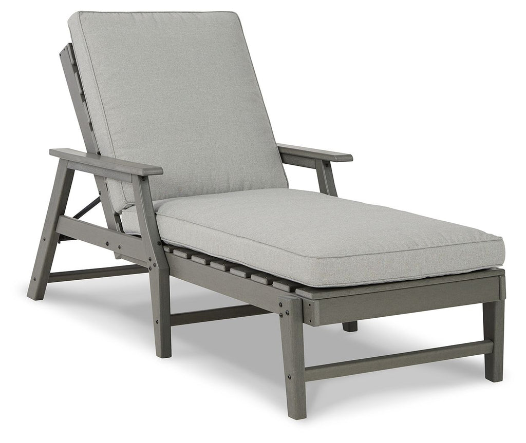 Gray chaise lounge chair with cushion, padded backrest and matching armrests