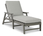 Gray chaise lounge chair with cushion, padded backrest and matching armrests