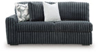 Ribbed corduroy sofa back view, gunmetal-gray upholstery, two throw pillows