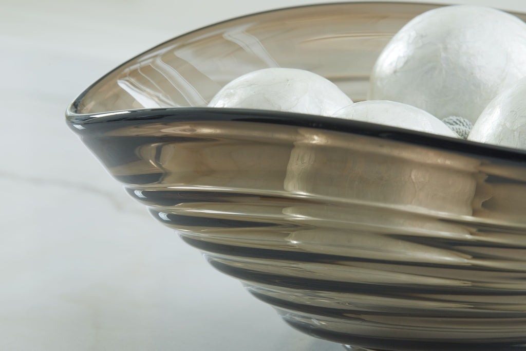Solariston gray-brown bowl with black rim and stripe pattern, plus white spheres