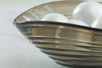 Solariston gray-brown bowl with black rim and stripe pattern, plus white spheres