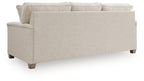 Queen sofa sleeper with light beige upholstery, wide track arms, and tapered legs