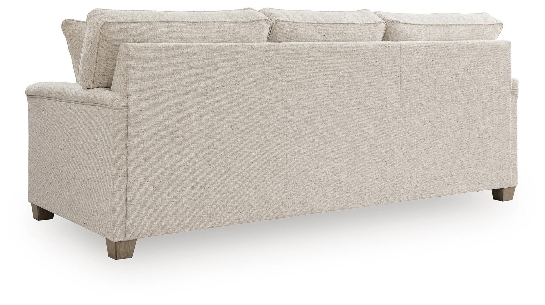 Queen sofa sleeper with light beige upholstery, wide track arms, and tapered legs