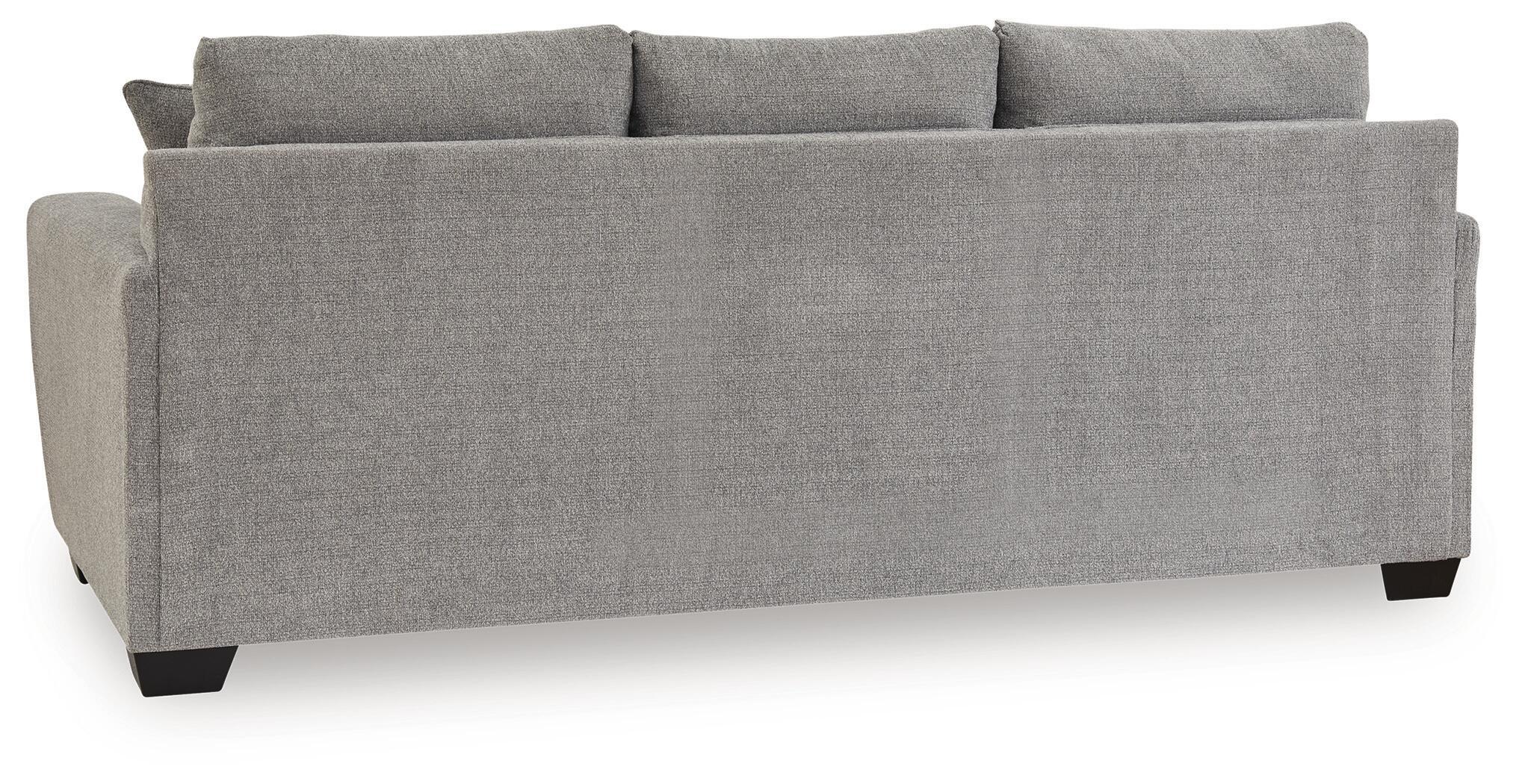 Gray upholstered sofa back with three back cushions