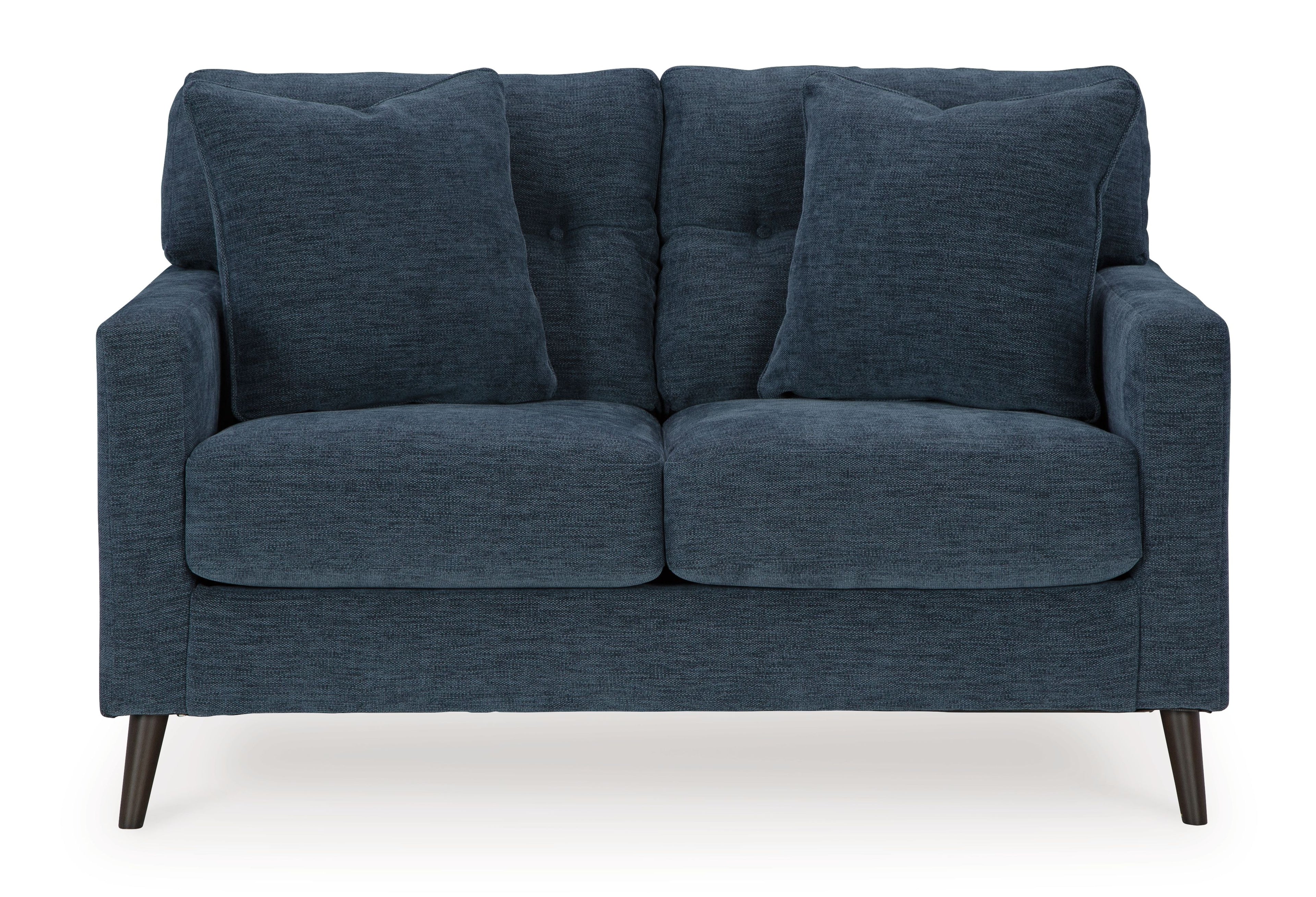 Blue loveseat with tufted back and two padded seat cushions with rolled arms.