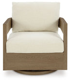 Back view of swivel glider chair with white cushion and dark brown base