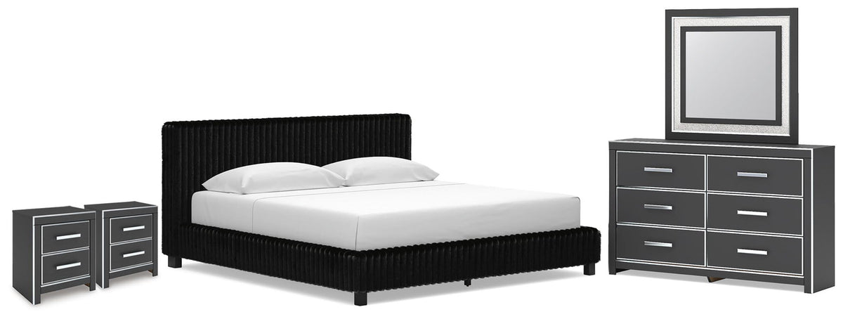 Black upholstered bed with two nightstands and dresser with framed mirror