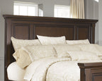 Queen panel headboard in rustic dark brown with raised top rail and inset panels
