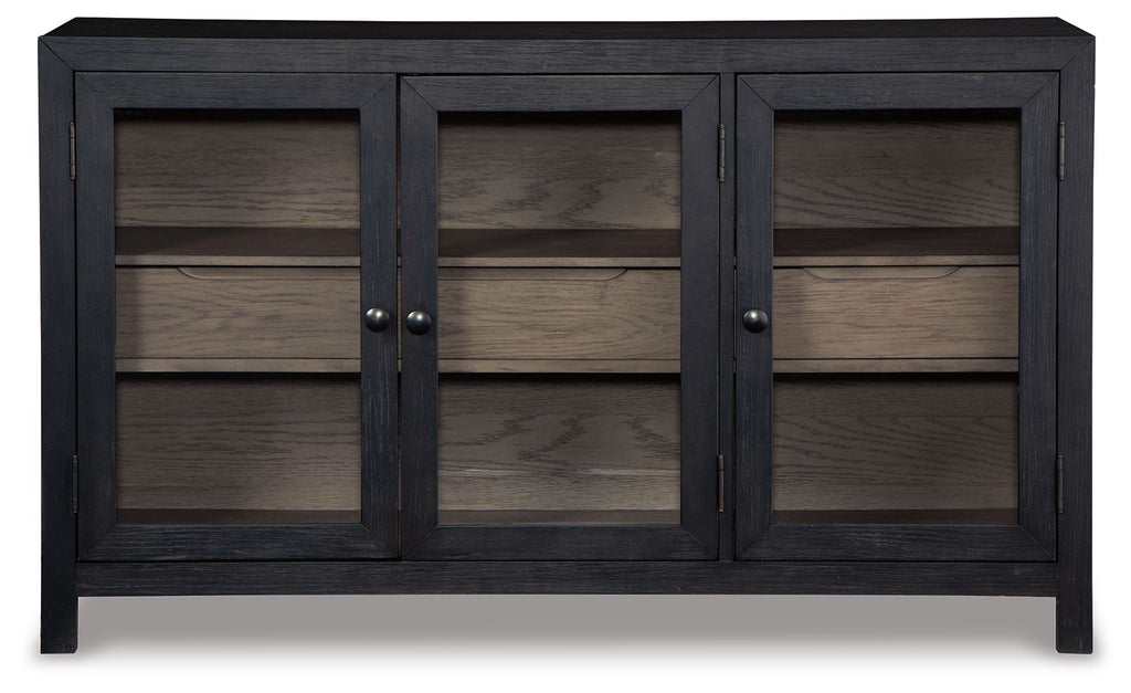 Dark gray accent cabinet with three closed doors and interior shelving behind them