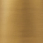 Gold metal lamp surface close-up with brushed finish texture