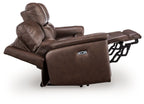 Dark brown power reclining sofa with extended footrest and adjustable headrest