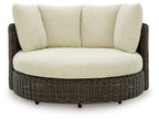 Swivel lounge chair with cushion, beige upholstery and dark brown woven rattan base