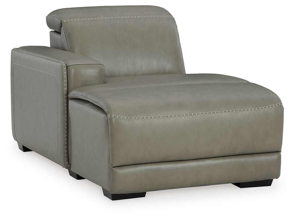 Gray upholstered reclining back chaise with stitched armrest and wide seat cushion