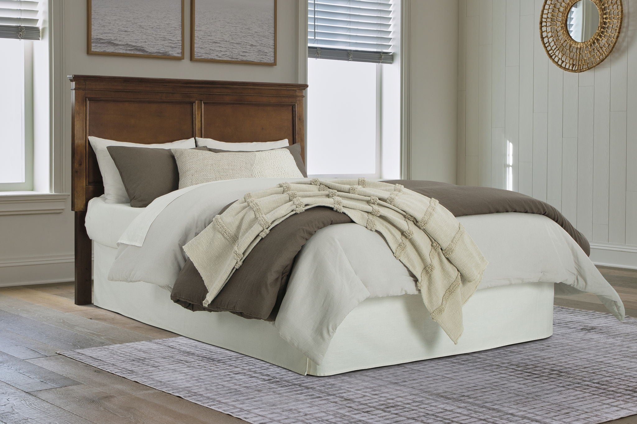 Brown wood headboard with rectangular panel design at a queen bed center