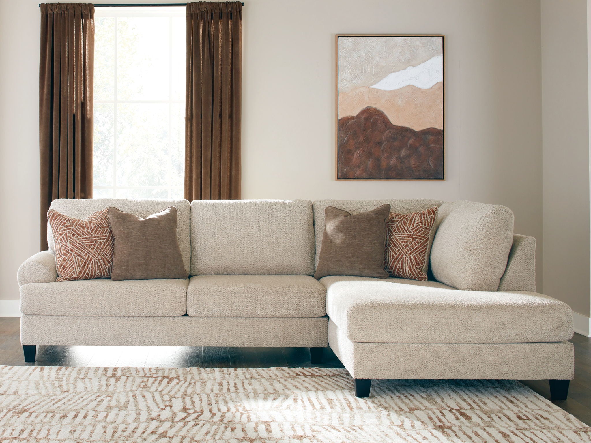 Light beige sectional sofa with right corner chaise, dark legs, 5 accent pillows
