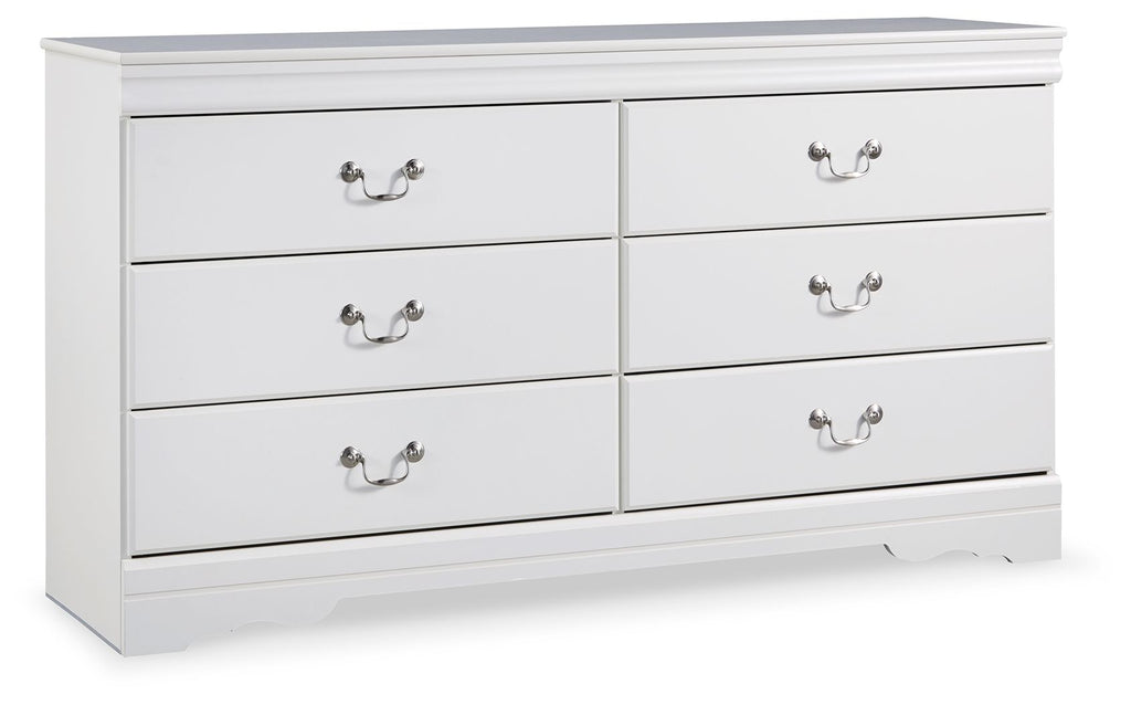 White dresser with six drawers and curved knob pulls