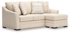 Beige fabric sectional sofa with chaise, multiple throw pillows