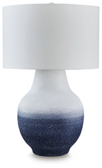 Metal table lamp with white drum shade and speckled navy-to-white ceramic base