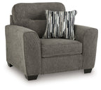 Dark gray accent chair with one arm cushion and striped throw pillow on the seat