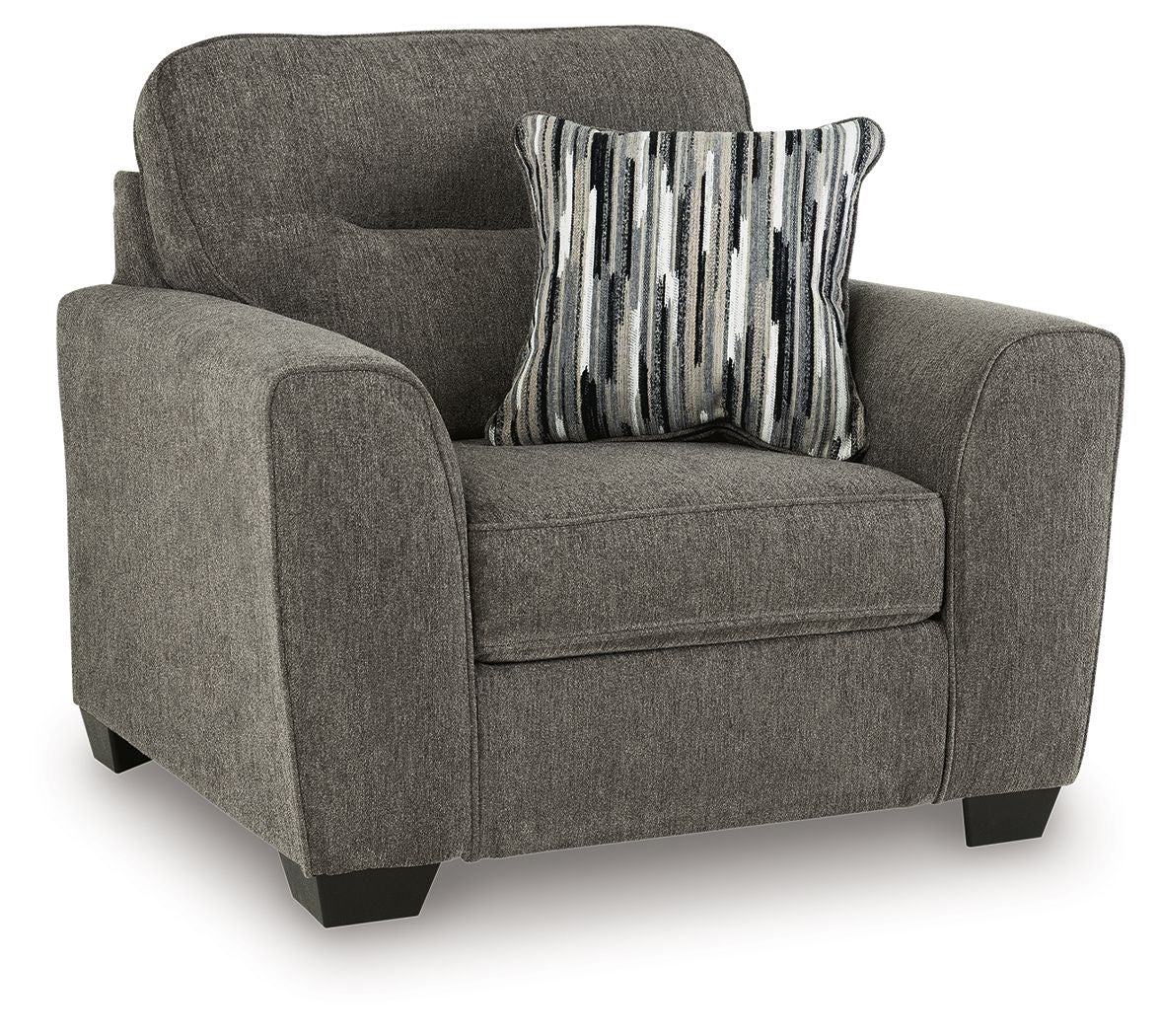 Dark gray accent chair with one arm cushion and striped throw pillow on the seat