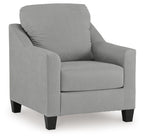 Upholstered accent chair with tall back and light gray fabric, padded armrests.
