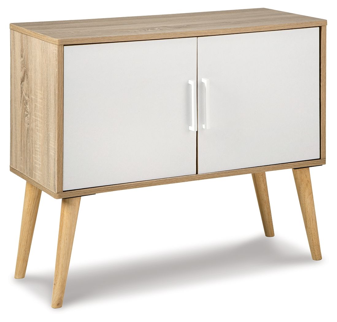 Light wood accent cabinet with two doors and vertical gold handles, angled legs