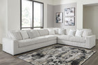 Gray sectional sofa with chaise, ribbed upholstery and plush tufted back pillows