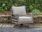 Gray upholstered swivel lounge chair with armrests and seat cushion, on round base