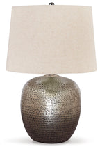 Antique silver metal table lamp with textured base and beige fabric drum shade