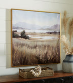 Framed landscape wall art print showing wildflowers, fields, and mountain range