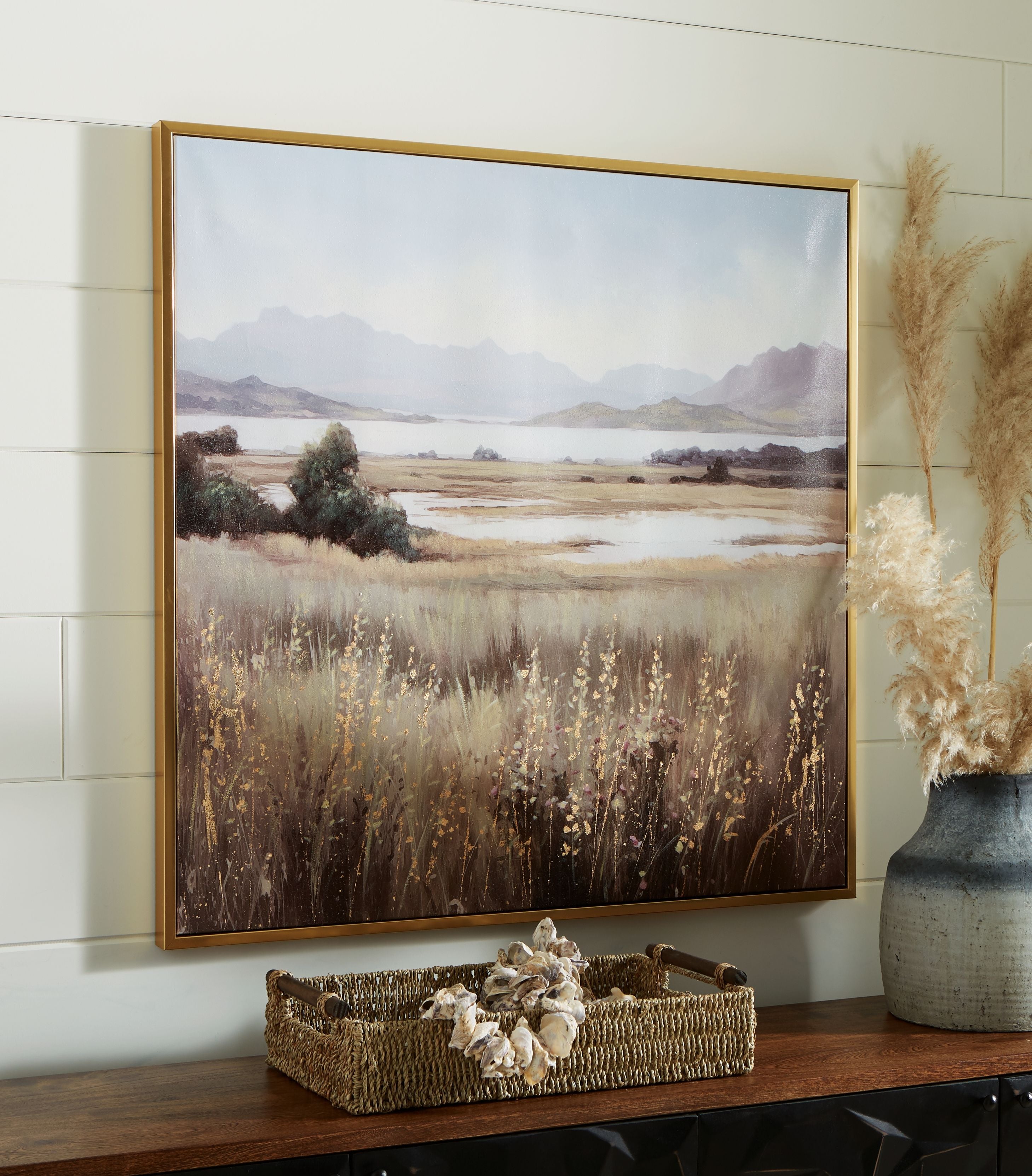 Framed landscape wall art print showing wildflowers, fields, and mountain range