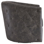 Dark swivel accent chair side view with button-tufted back and padded armrests