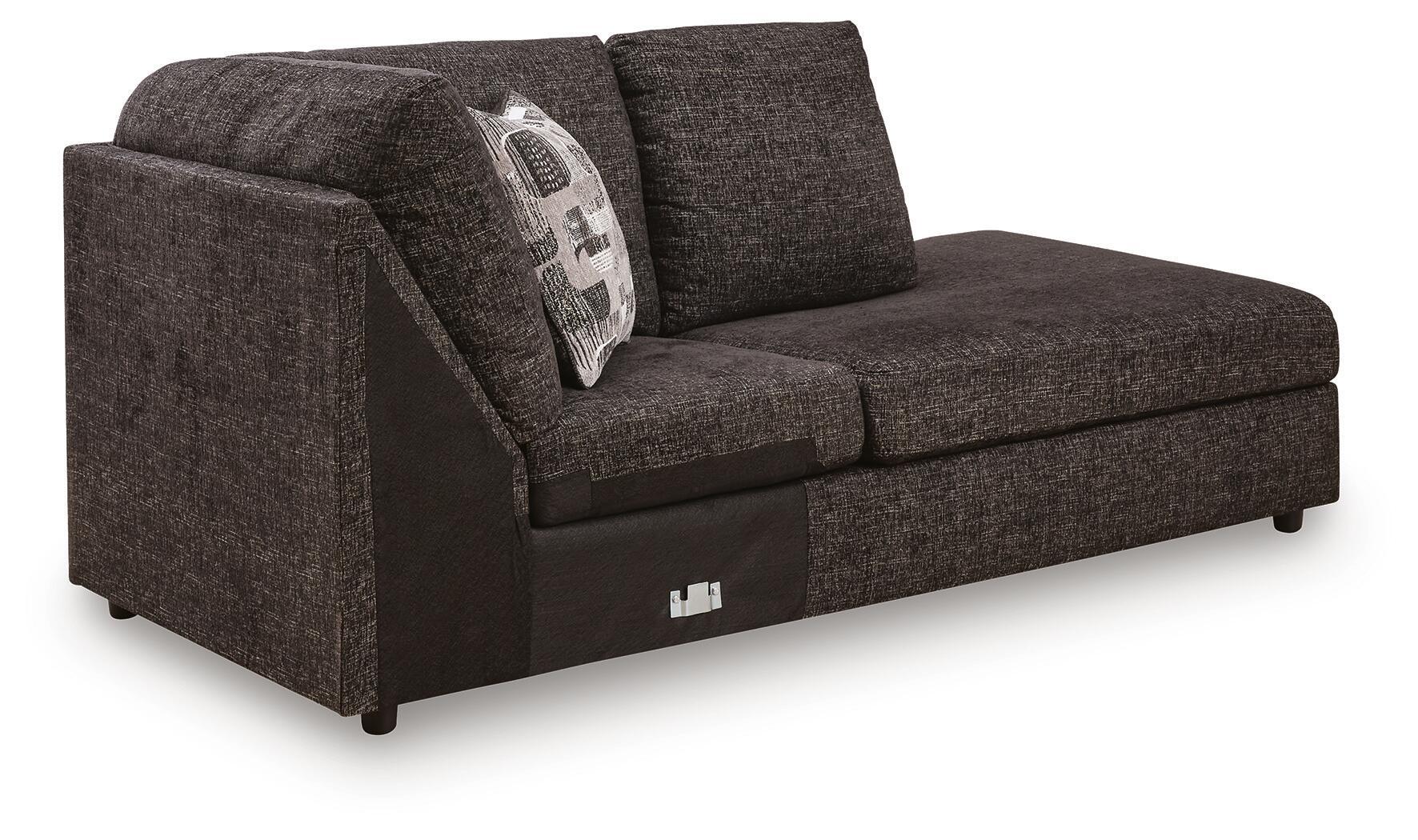 Corner chaise sofa, dark textured fabric, curved arms, patterned back cushion, block legs