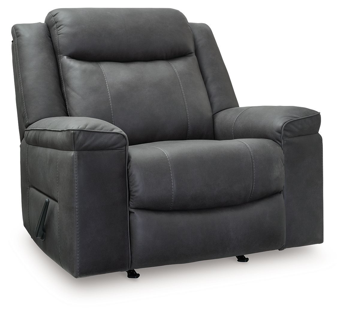 Dark gray rocker recliner chair with padded arms, stitched back, and retractable lever.