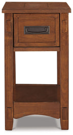 Brown wooden chair side end table with centered drawer and open shelf