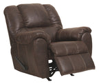 Walnut brown leather rocker recliner with padded headrest and pull-out footrest