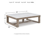 Rectangular cocktail table with light marble-look top, brown wood legs and lower shelf.