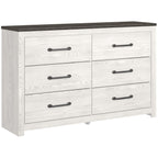 White panel dresser with dark metal bar handles and multiple drawers