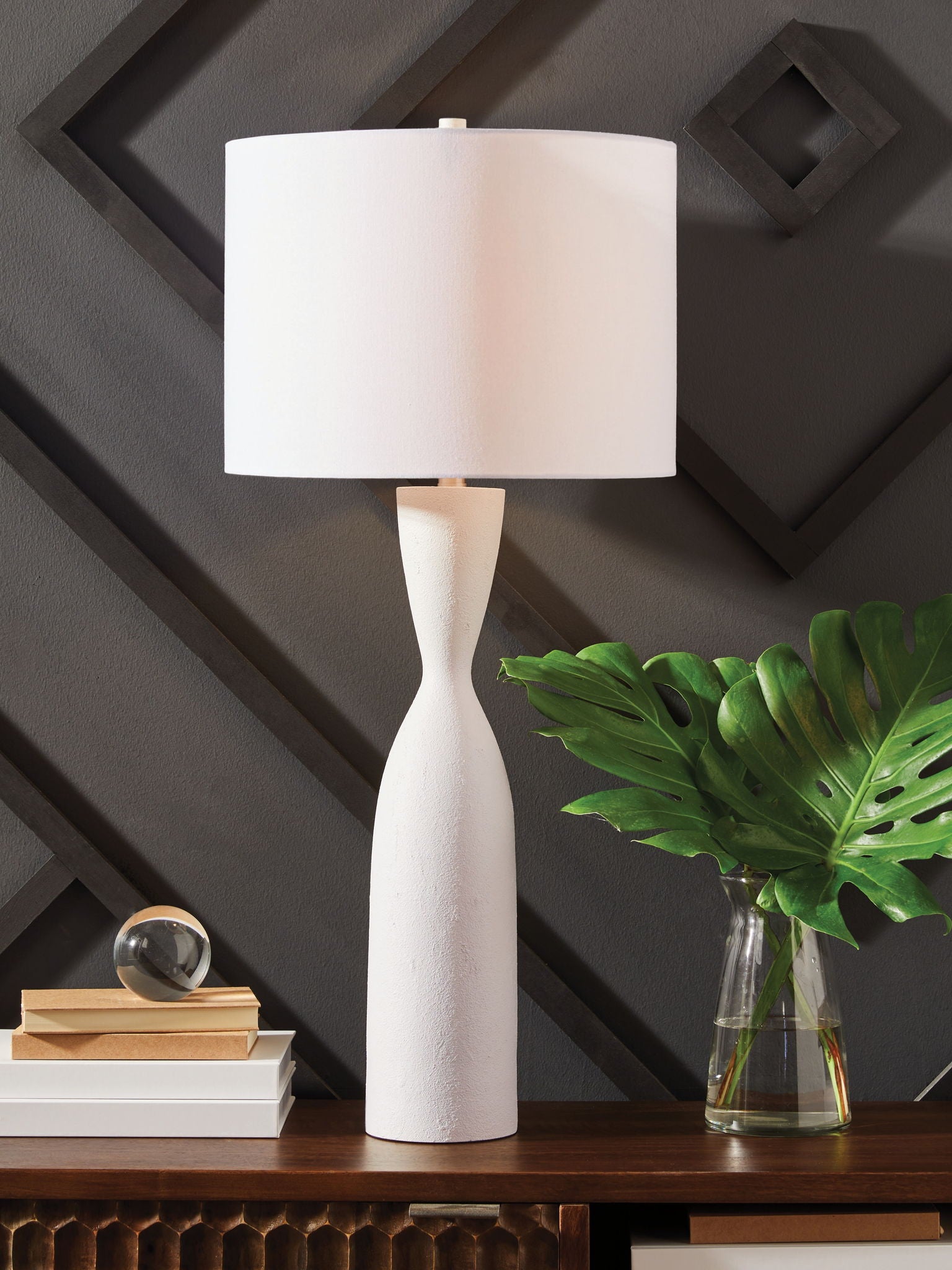 White poly table lamp with rectangular fabric shade and tall sculpted base