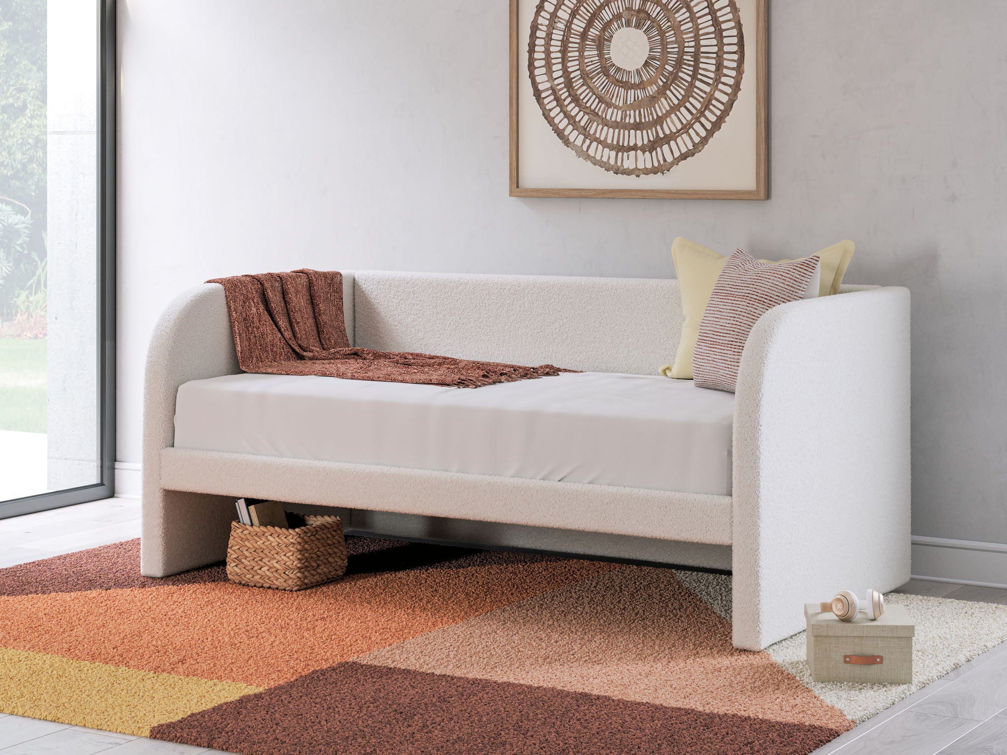 Upholstered day bed in beige fabric with white mattress; side view with two under-bed drawers
