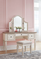 Corner vanity with arched mirror, drawers on both sides, and beige upholstered stool