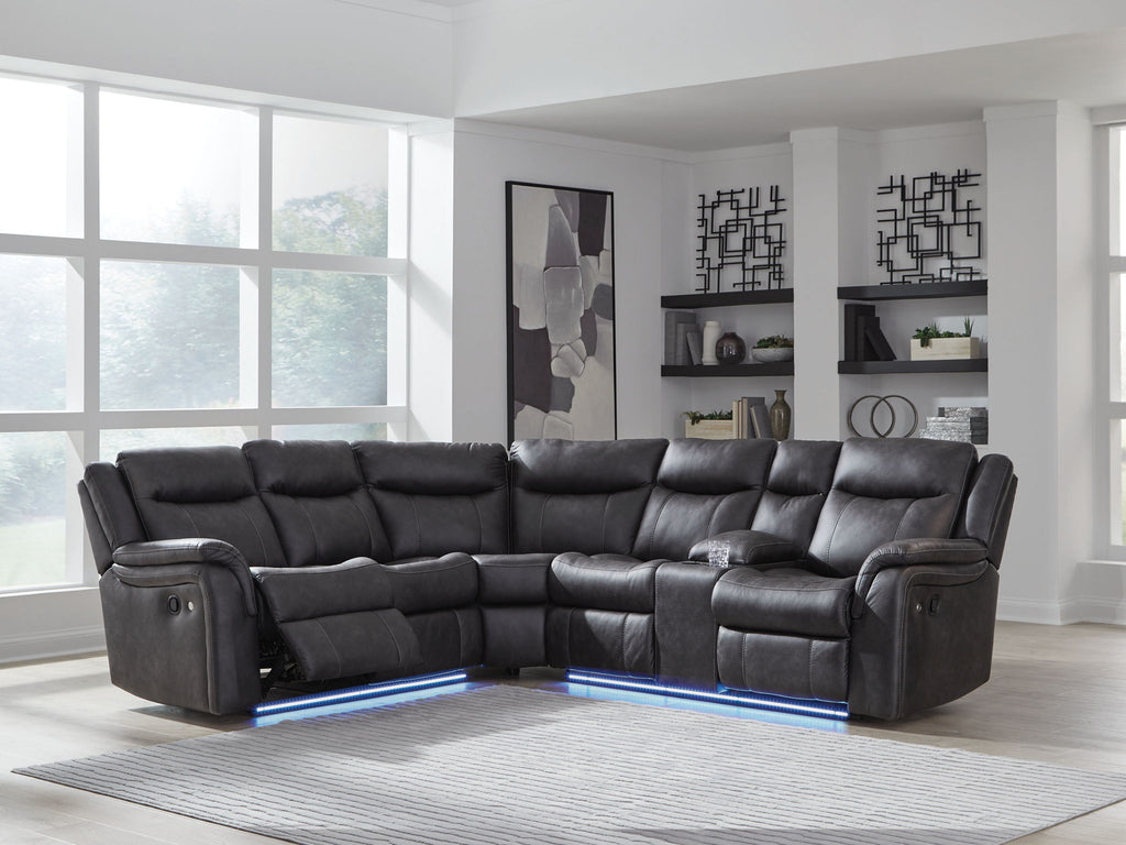 Dark carbon reclining sectional sofa with tufted back cushions and an extended chaise section.
