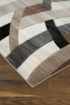 Jacinth rug with geometric stripes in dark brown, tan, gray, and black