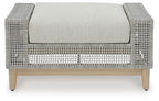 Gray ottoman with rounded armrests, woven texture, and centered upholstered cushion