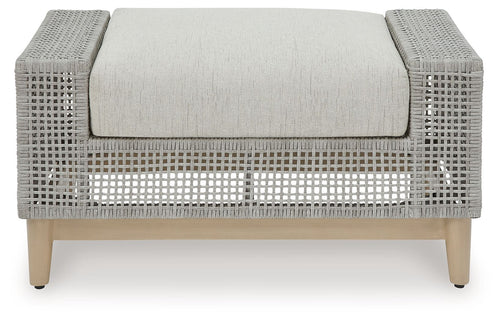 Gray ottoman with rounded armrests, woven texture, and centered upholstered cushion
