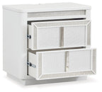 White two-drawer nightstand with one drawer pulled out, side-mounted metal slides.