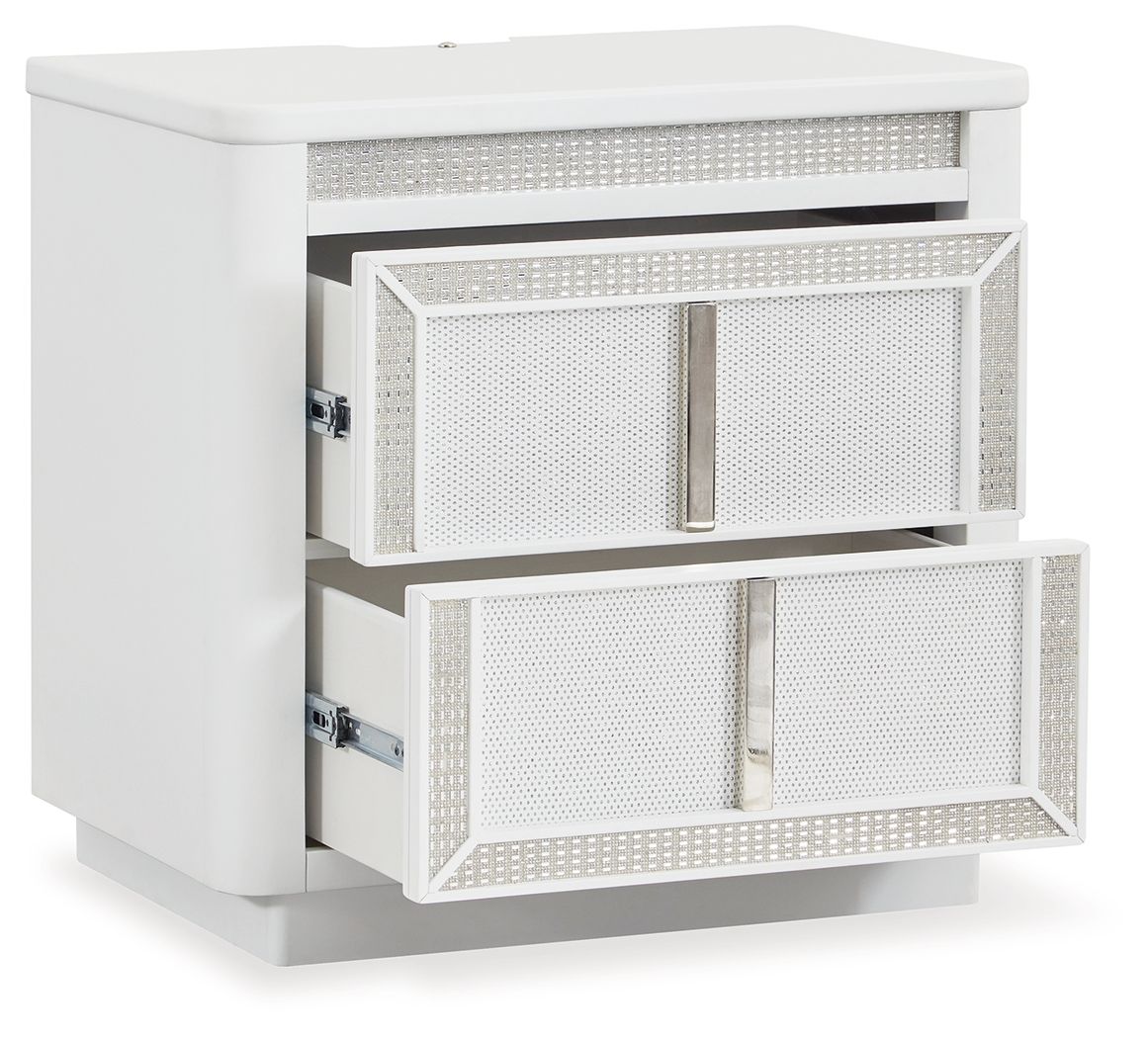 White two-drawer nightstand with one drawer pulled out, side-mounted metal slides.