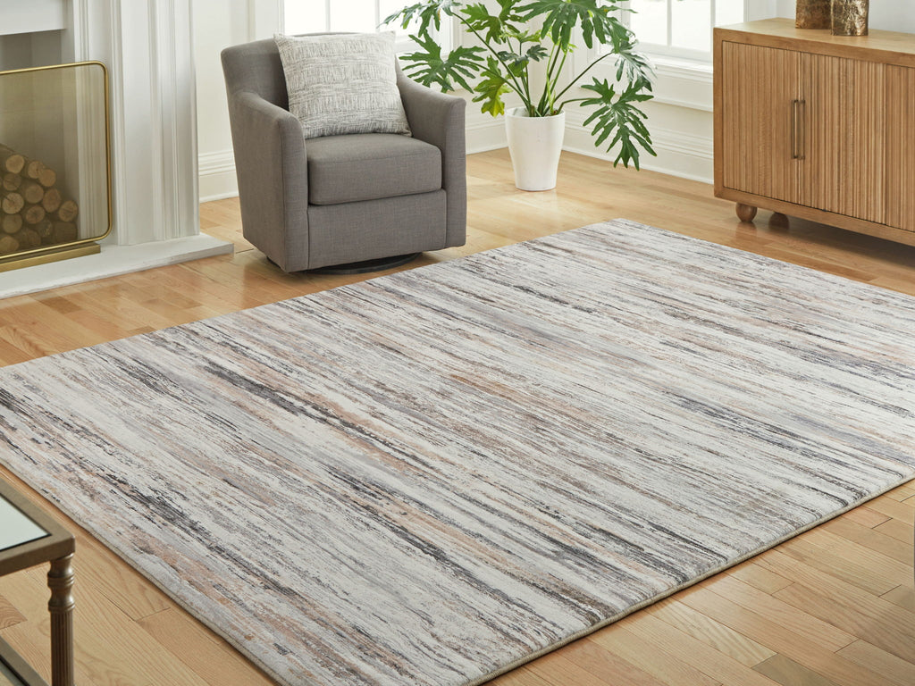 Nace area rug, cream and gray distressed lines, laid flat in living room
